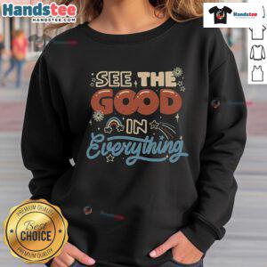 Cozy sweatshirt featuring 'See The Good In Everything' design, perfect for uplifting casual wear and positivity.