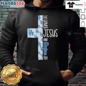 Alt Text: Woman wearing a hoodie that says She Loves Jesus and Los Angeles Dodgers Too, showcasing faith and team spirit.