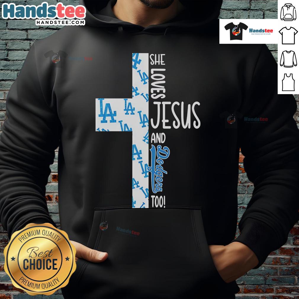 Alt Text: Woman wearing a hoodie that says She Loves Jesus and Los Angeles Dodgers Too, showcasing faith and team spirit.