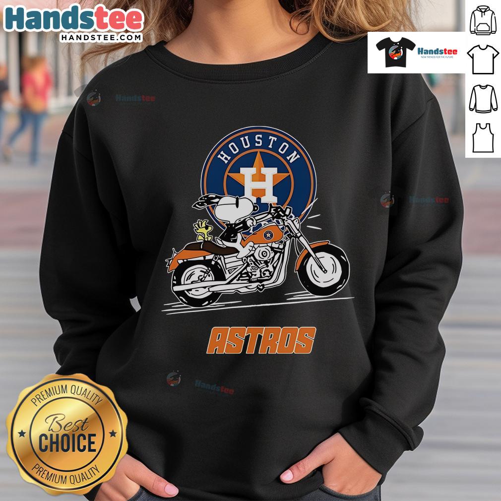 Snoopy and Woodstock driving a motorbike on a Houston Astros sweatshirt, showcasing fun, vibrant design.