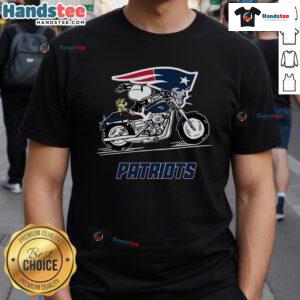 Alt Text: Snoopy and Woodstock riding a motorbike on a New England Patriots t-shirt, showcasing playful team spirit.