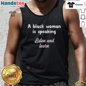 Black woman wearing 'Listen and Learn' tank top, promoting empowerment and education in a vibrant setting.