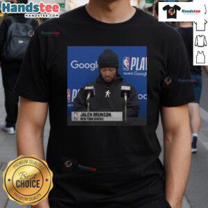 Official Jalen Brunson Press Conference T-Shirt featuring team logo and player name, perfect for fans and collectors.