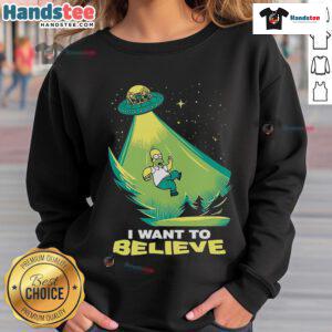Funny 'I Want to Believe' Homer Simpson UFO sweatshirt featuring iconic cartoon character and humorous design.