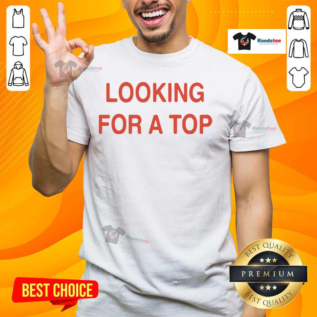 Stylish model wearing a 'Good Looking For A Top' t-shirt, showcasing trendy design and vibrant colors for fashion enthusiasts.
