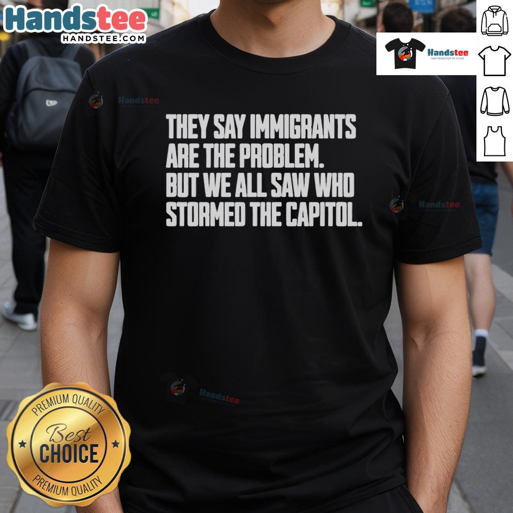 Hot T-Shirt featuring 'Immigrants Are The Problem? Look Who Stormed The Capitol' design, promoting social justice and awareness.