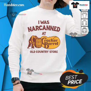 Cozy sweatshirt featuring 'Nice, I Was Narcanned' design at an old country store, perfect for casual wear.
