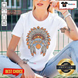 Alt Text: Official New York Knicks Native American Logo ladies tee featuring vibrant colors and stylish design for fans.