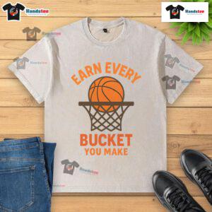 Awesome Earn Every Bucket You Make Washed T-Shirt featuring a stylish design, perfect for casual wear and sports enthusiasts.