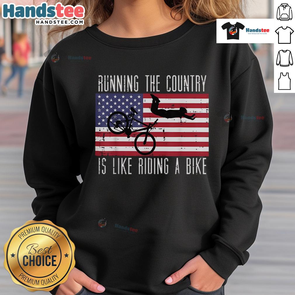 Funny running the country is like riding a bike sweatshirt, featuring humorous graphics and bold text design.