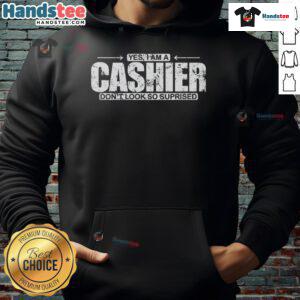 Funny hoodie featuring 'Yes, I Am A Cashier, Don't Look So Surprised' text, perfect for casual wear and humor lovers.