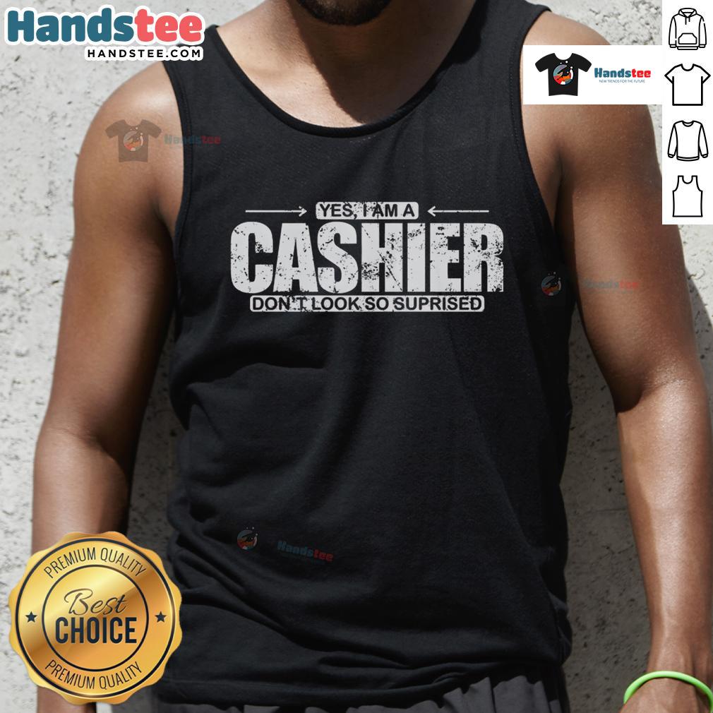 Funny 'Yes, I Am A Cashier, Don't Look So Surprised' tank top design featuring a humorous graphic and bold text.