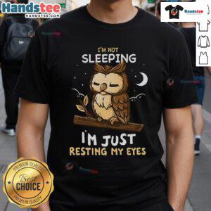 Alt Text: Funny 'Good I'm Not Sleeping I'm Just Resting My Eyes' T-Shirt design featuring playful typography on a casual tee.