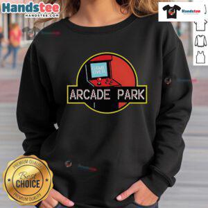 Nice Arcade Park X Jurassic Park sweatshirt featuring vibrant graphics and a cozy fit, perfect for fans of retro gaming.