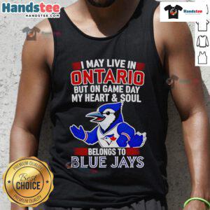 Woman wearing a Toronto Blue Jays tank top showing team spirit, saying 'My heart belongs to the Toronto Blue Jays'.