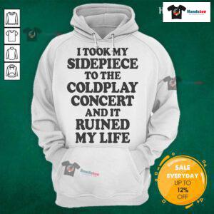 Person wearing a 'Nice I Took My Sidepiece To The Concert And It Ruined My Life' hoodie at a lively concert venue.
