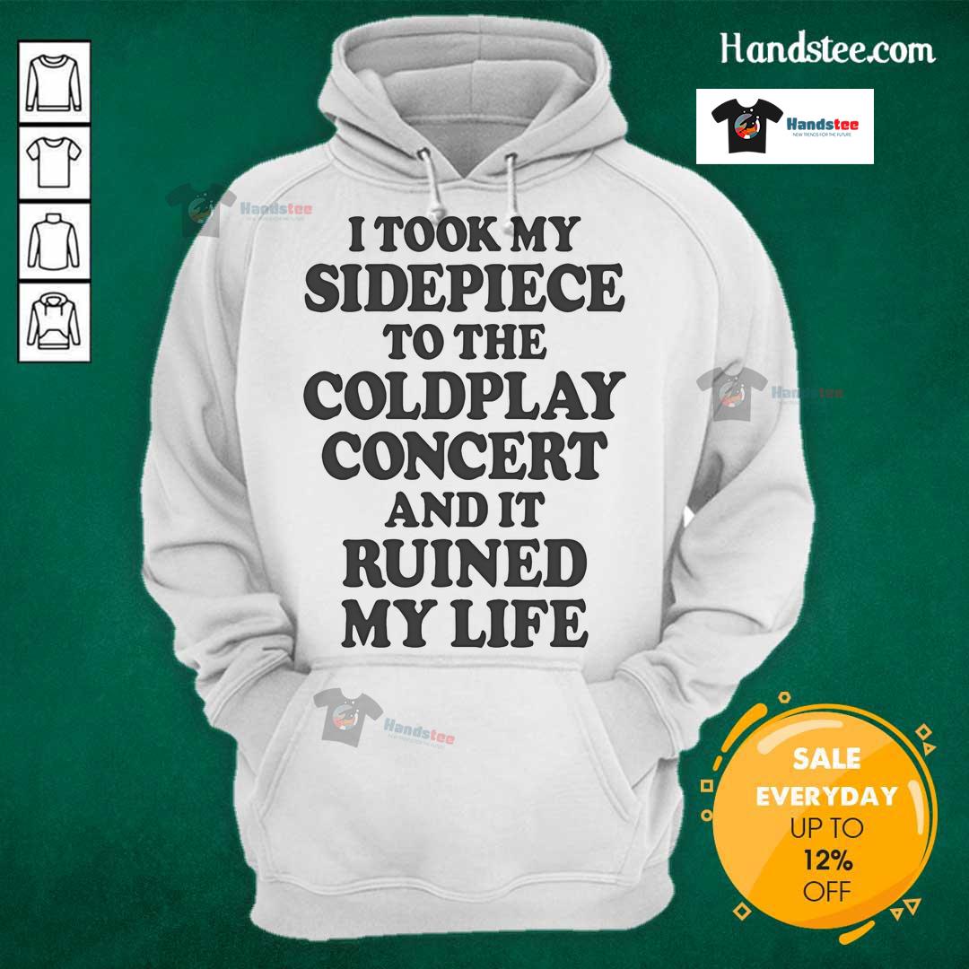Person wearing a 'Nice I Took My Sidepiece To The Concert And It Ruined My Life' hoodie at a lively concert venue.