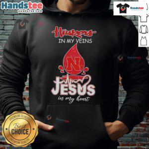 Nice Nebraska Husker in My Veins Jesus in My Heart Hoodie showcasing team spirit and faith in a stylish design.