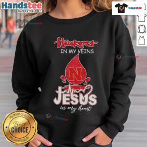 Nice Nebraska Husker in My Veins Jesus in My Heart sweatshirt displayed on a mannequin, showcasing team spirit and faith.