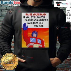 Person wearing a Transformers cartoon hoodie, raising their hand, showcasing love for cartoons regardless of age.