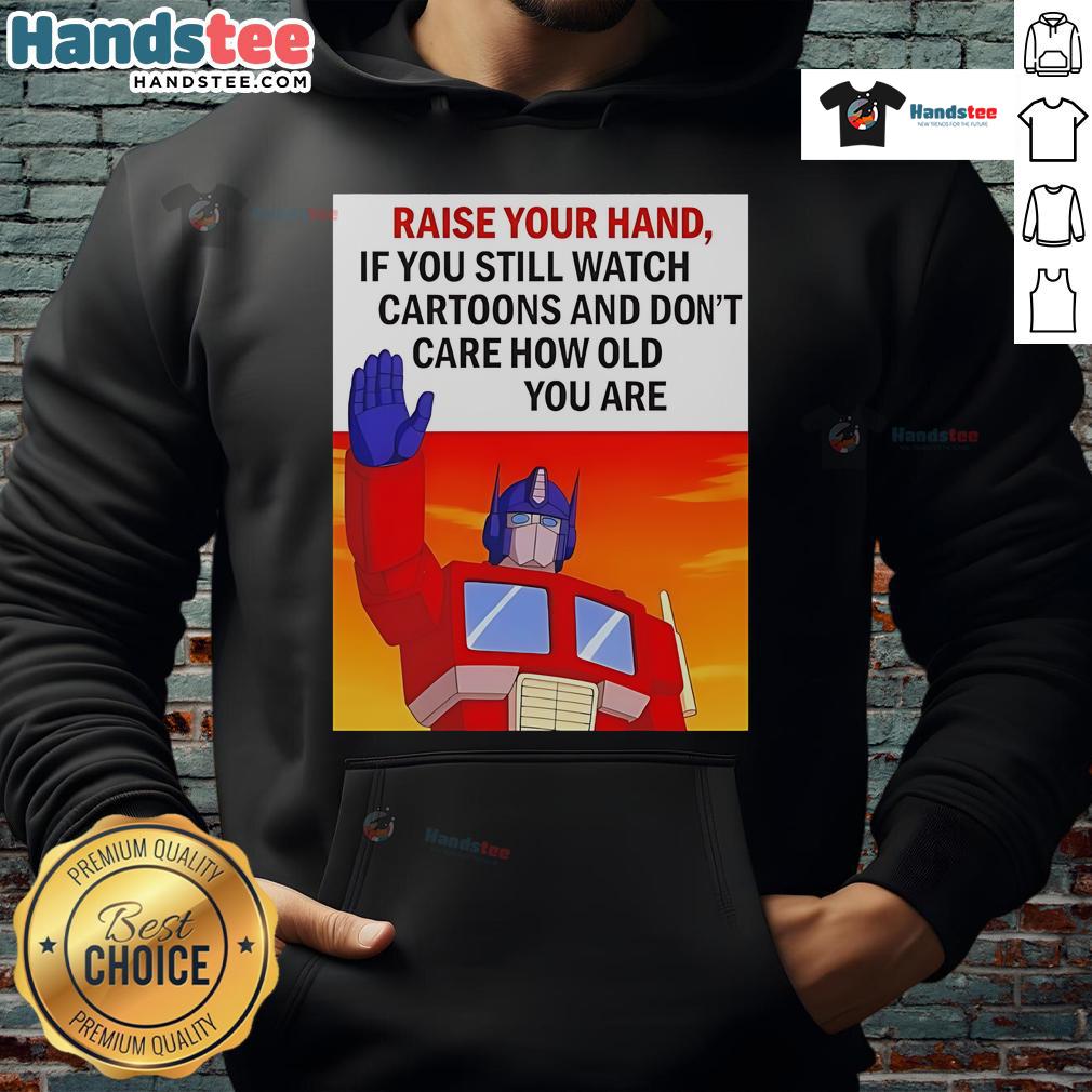 Person wearing a Transformers cartoon hoodie, raising their hand, showcasing love for cartoons regardless of age.