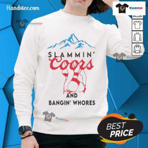 Alt Text: Cozy 'Nice Slammin Coors and Bangin Whores' sweatshirt featuring bold text design, perfect for casual wear.