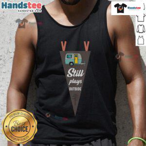 Nice still plays outside RV camper in a camping tank top, enjoying nature and outdoor adventures on a sunny day.