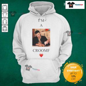 Tom Blyth wearing a stylish 'I'm A Croomf' hoodie, showcasing a trendy casual look and modern fashion style.