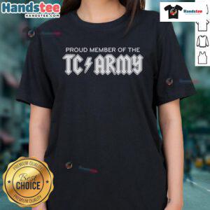Tom Caron proudly wearing a TC Army Metal Ladies Tee, showcasing team spirit and stylish design.
