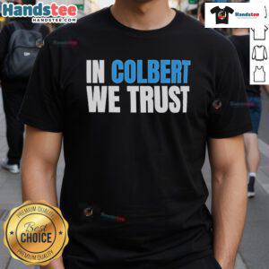 Official In Colbert We Trust T-Shirt featuring bold lettering on a stylish black fabric for fans of Stephen Colbert.