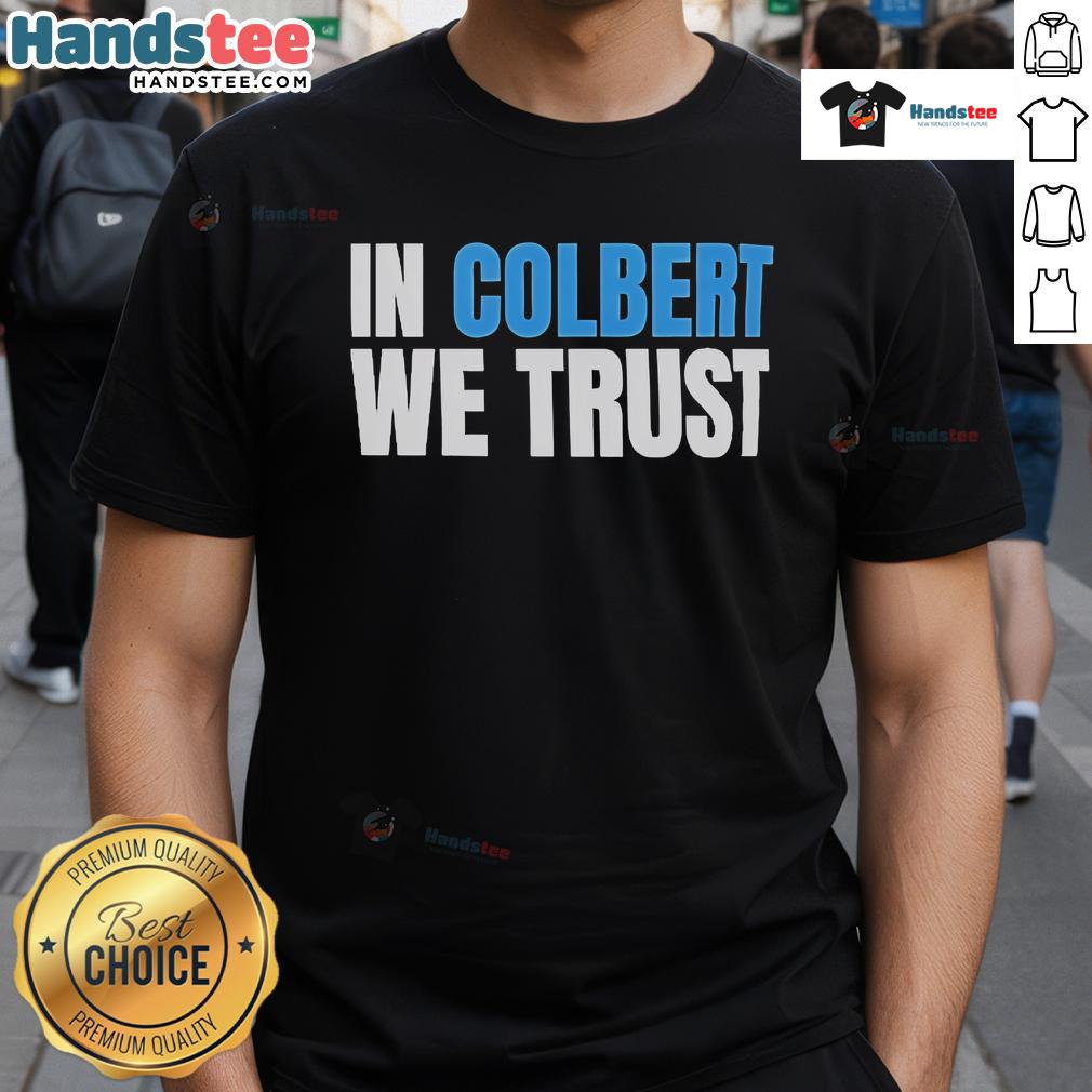 Official In Colbert We Trust T-Shirt featuring bold lettering on a stylish black fabric for fans of Stephen Colbert.