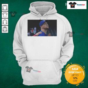Jeff Hoffman blowing a kiss while wearing a Toronto Blue Jays baseball hoodie, showcasing team spirit.