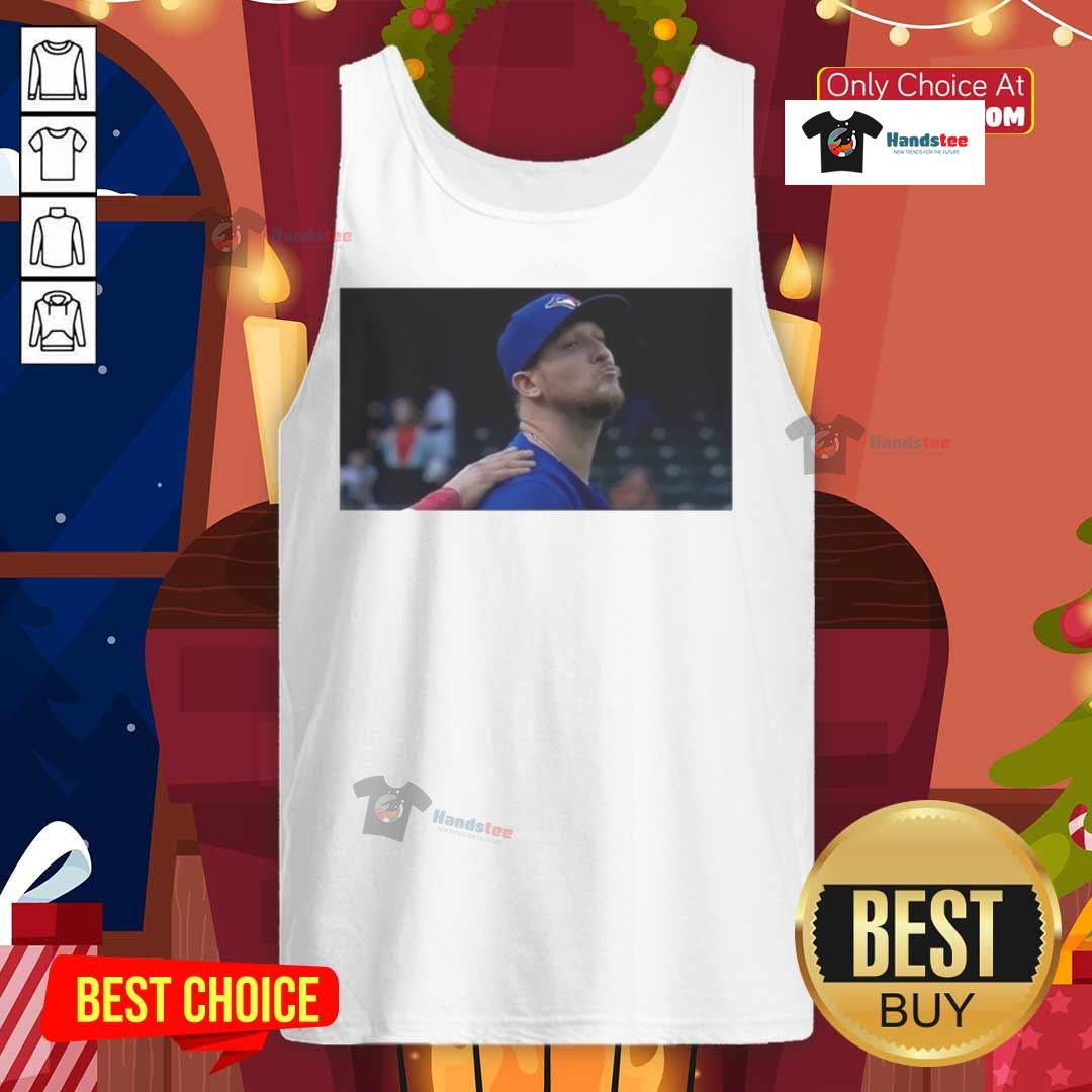 Jeff Hoffman blowing a kiss in a Toronto Blue Jays baseball tank top, showcasing team spirit and sporty style.