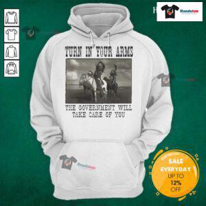 Native American hoodie featuring 'Turn In Your Arms, The Government Will Take Care Of You' message for cultural awareness.