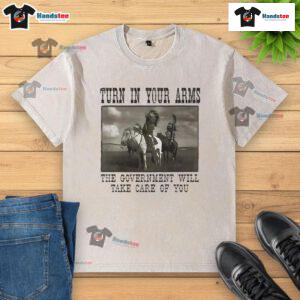 Official Turn In Your Arms T-Shirt featuring Native American design, highlighting government support and care.