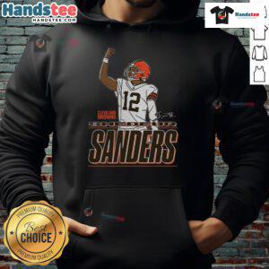Shedeur Sanders in a Cleveland Browns Believe hoodie, showcasing style and team spirit at a game.