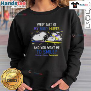 Alt Text: Cute Snoopy sweatshirt for bladder cancer awareness, featuring Every part of my body hurts and you want me to smile.