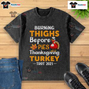Funny burning thighs before pies at the 2021 Thanksgiving Turkey Trot in a washed t-shirt, capturing festive running spirit.