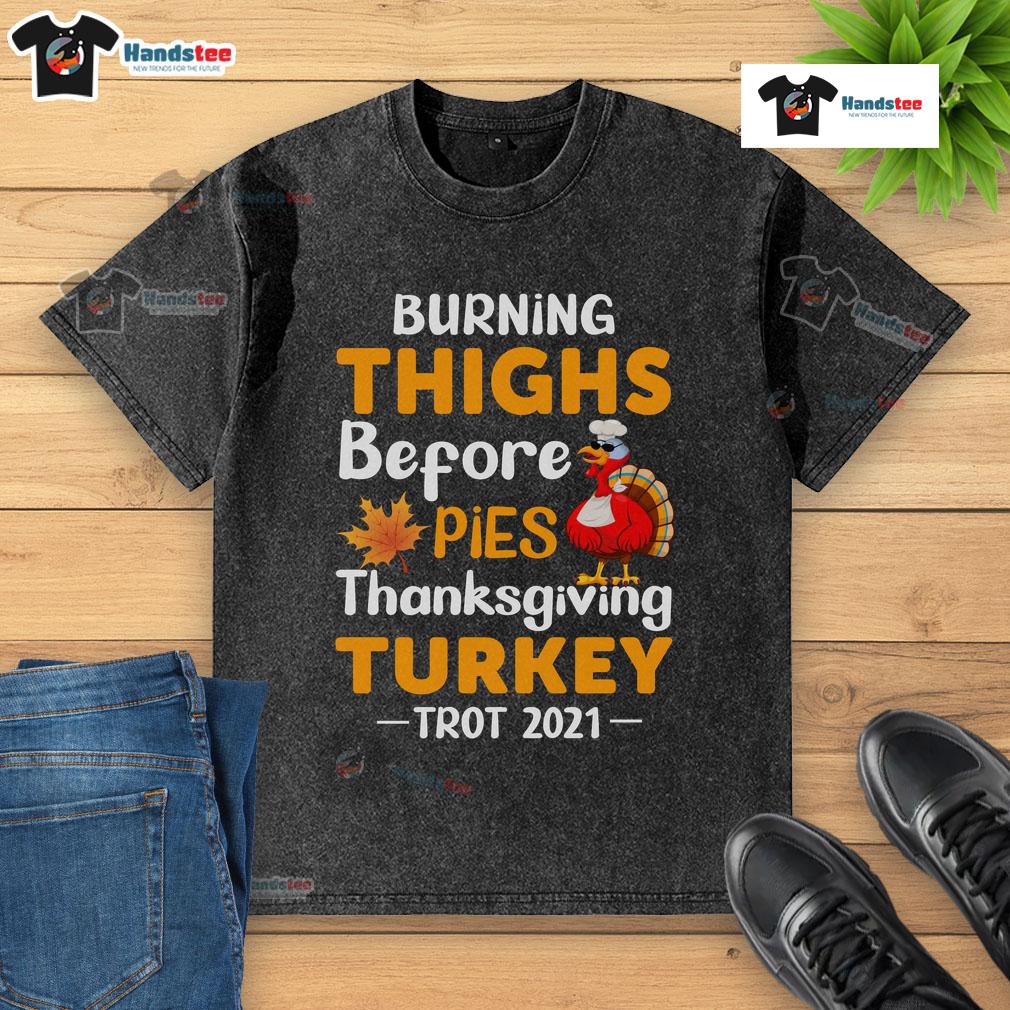 Funny burning thighs before pies at the 2021 Thanksgiving Turkey Trot in a washed t-shirt, capturing festive running spirit.