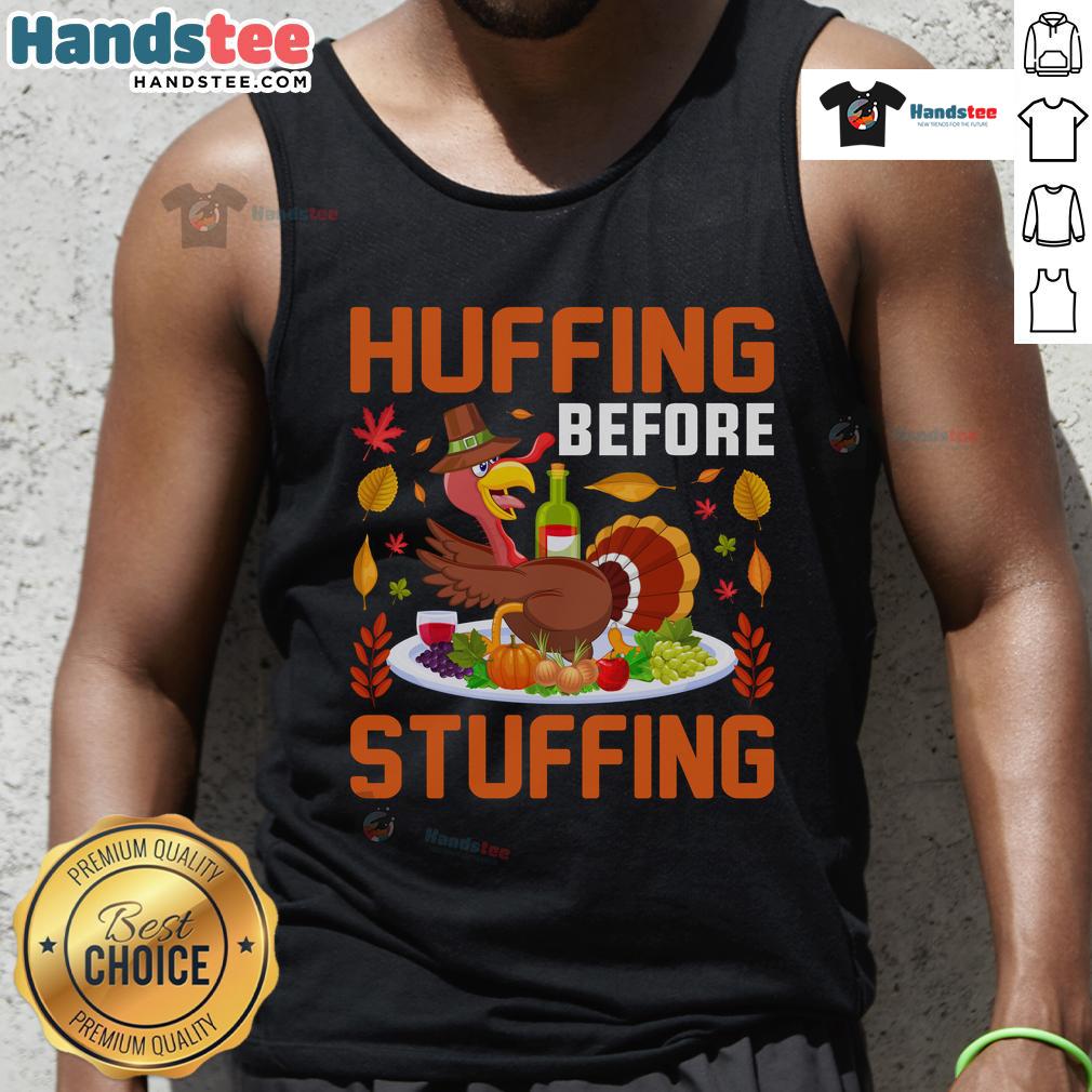 Funny huffing before stuffing Thanksgiving turkey, featuring a humorous wine-themed tank top for holiday celebrations.