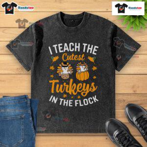 Funny I Teach The Cutest Turkeys In The Flock Teacher Thanksgiving T-Shirt design with cheerful turkey graphics.