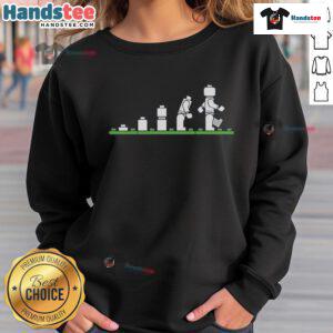 Funny Lego sweatshirt featuring humorous human evolution design with colorful Lego figures and playful graphics.