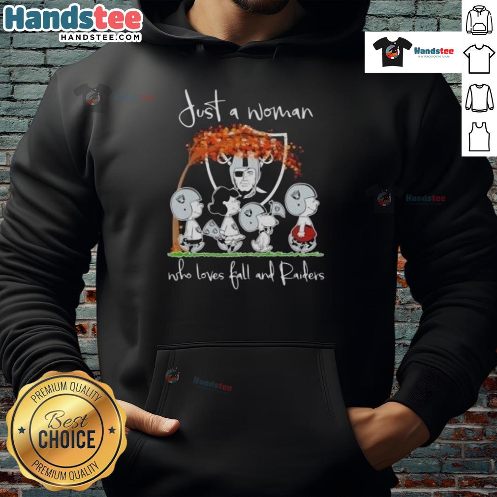 Woman in a cozy hoodie, showcasing her love for fall and the Las Vegas Raiders, surrounded by autumn leaves.