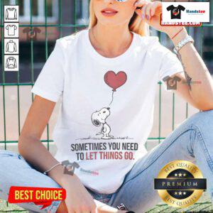 Good Snoopy Sometimes You Need to Let Things Go Ladies Tee featuring Snoopy and a motivational quote on a stylish shirt.