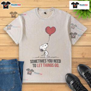 Good Snoopy 'Sometimes You Need To Let Things Go' washed t-shirt showcasing a relaxed design and vibrant colors.
