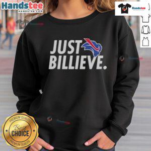 Happy Eric Wood wearing a Just Billieve sweatshirt, showcasing a vibrant design and positive message.