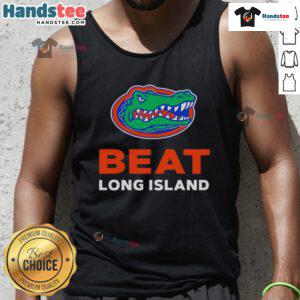 Happy Florida Gators fans wearing a tank top celebrating their victory over Long Island in a vibrant outdoor setting.