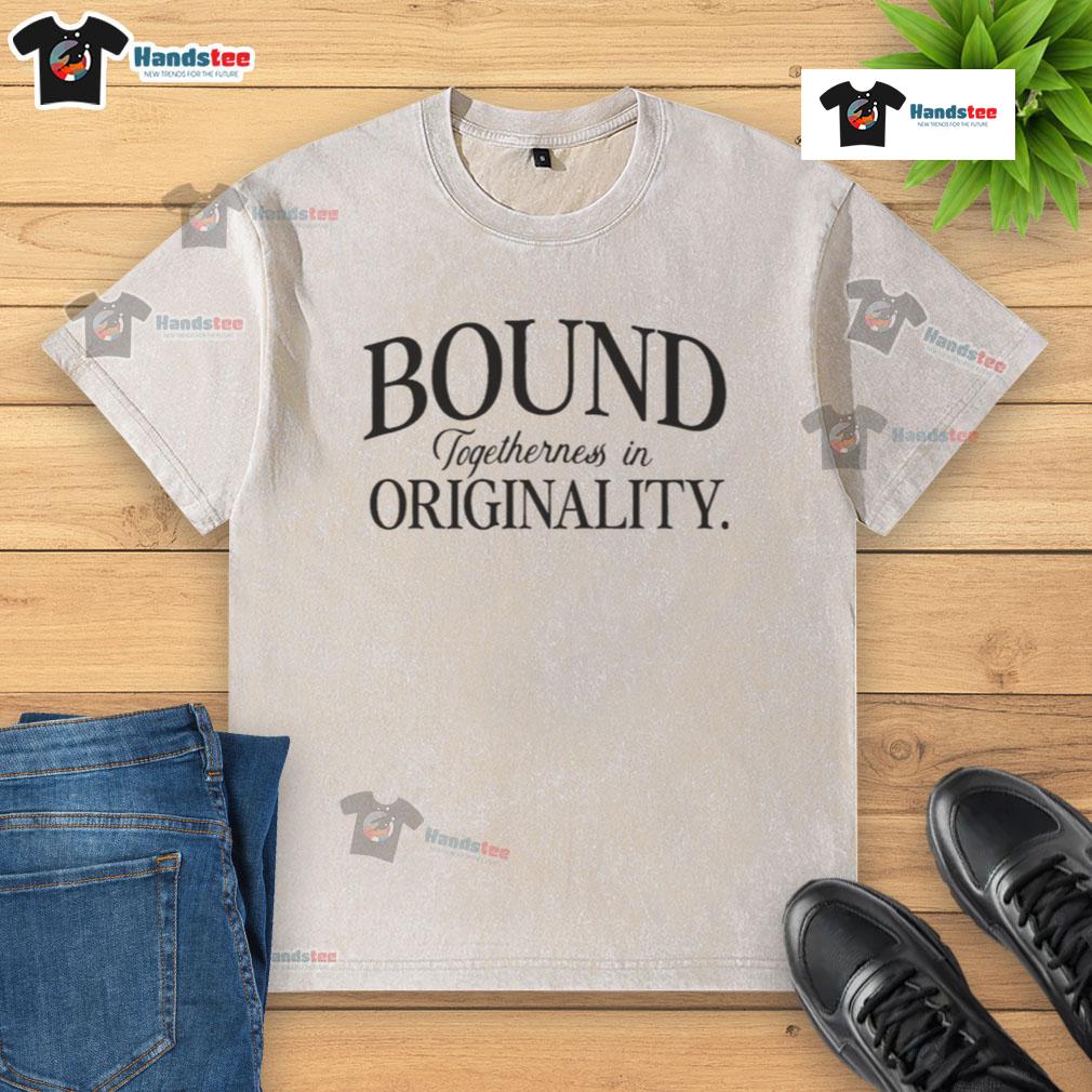 Nice Bound Togetherness in Originality washed t-shirt displayed on a wooden surface, showcasing its unique design and color.