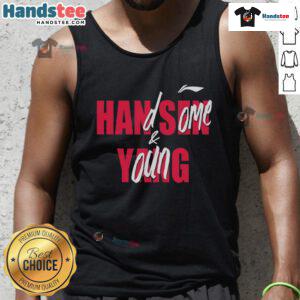 Handsome young man Casey Holdahl wearing a stylish tank top, showcasing a confident pose and a friendly smile.