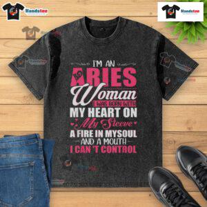 Aries woman wearing a stylish washed t-shirt with a heart on the sleeve, showcasing her fiery personality and bold expression.